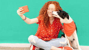 Girl taking a selfie with her dog